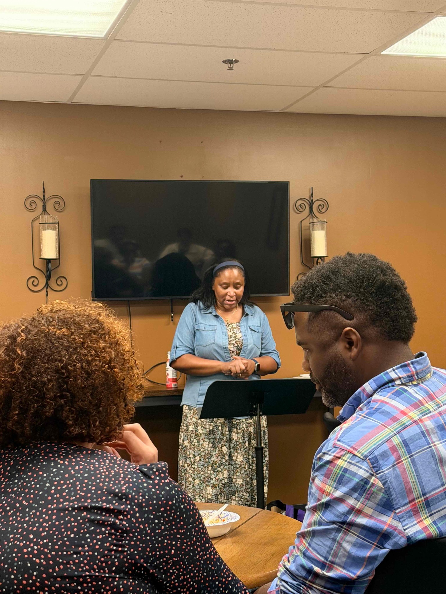 A woman leading a small group class